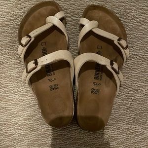 shiny cream Birkenstocks sandals